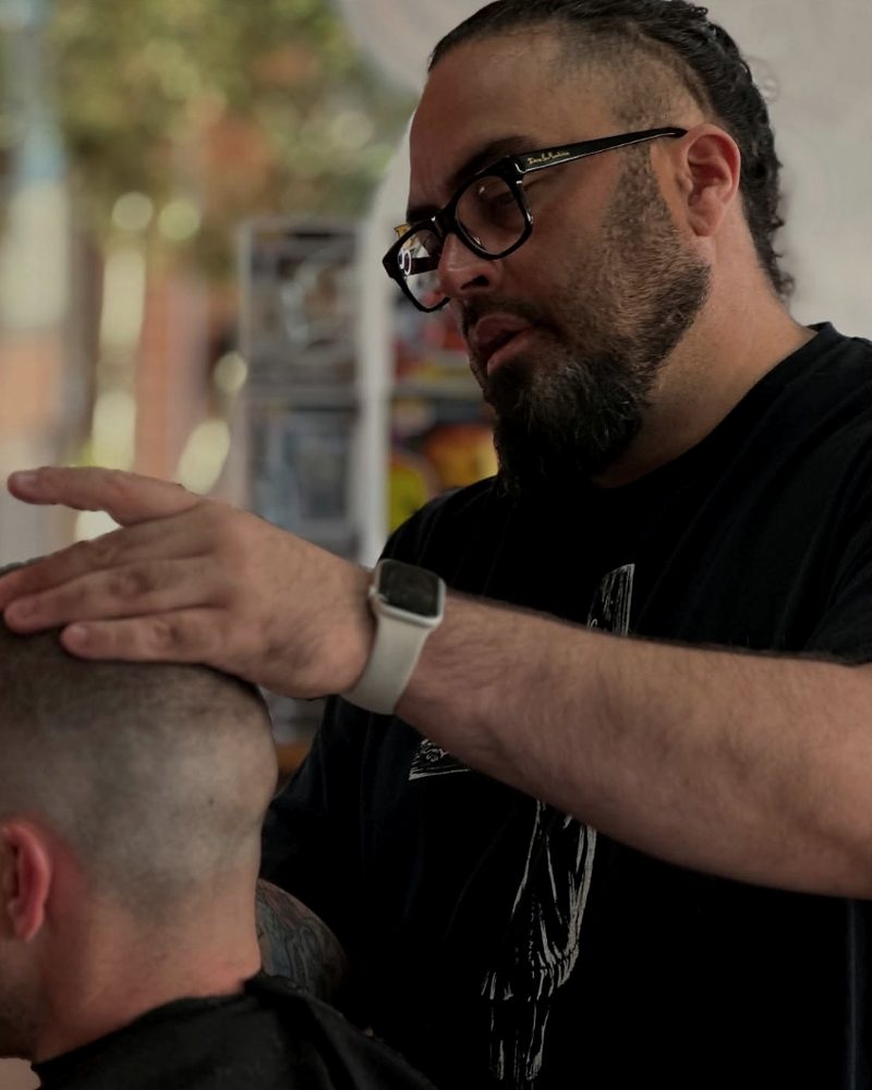 Fabio Dos Santos cutting hair at Fasto Barbering